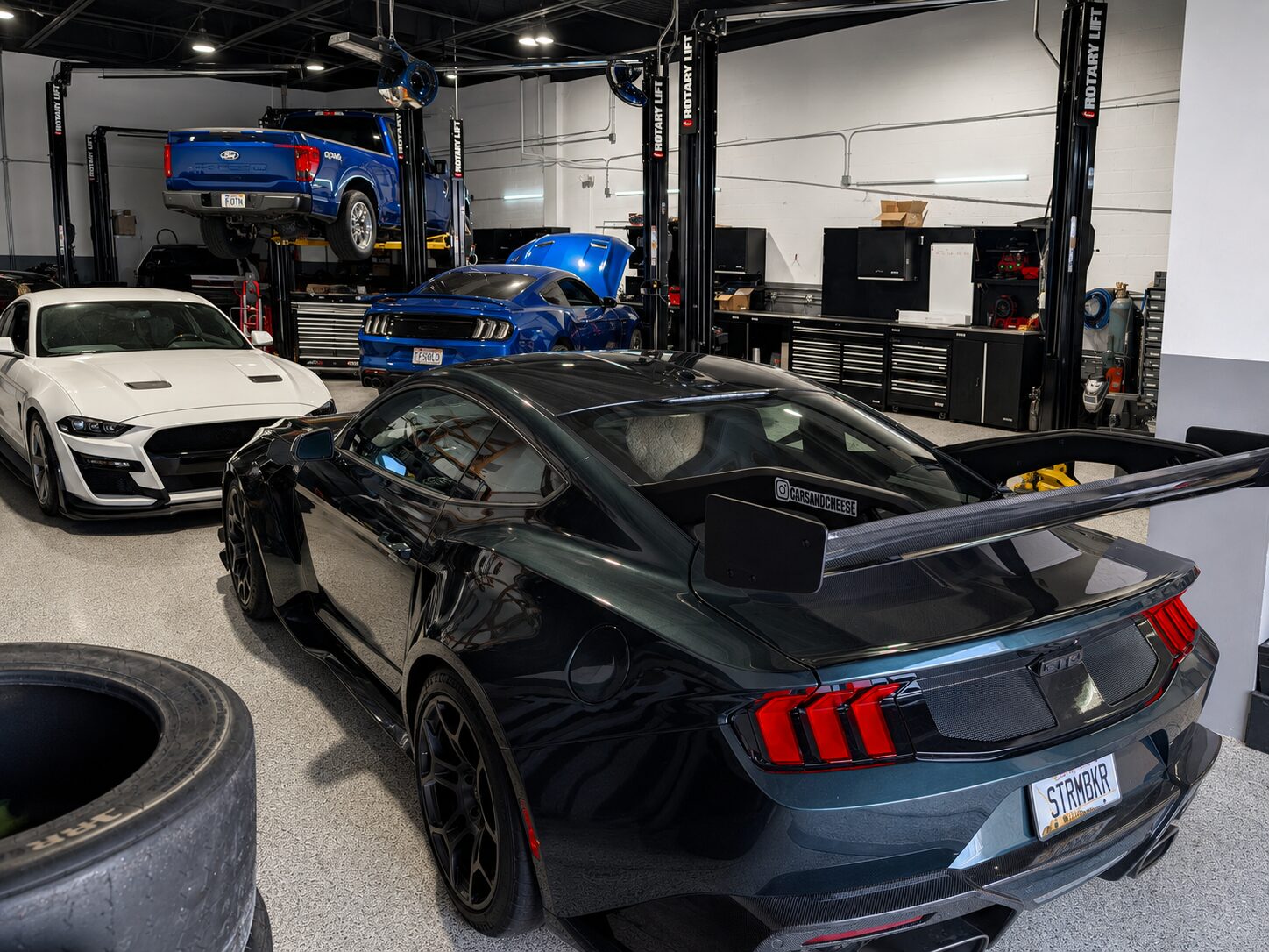 Wide shop view of Palm Beach Dyno's Rotary lifts and work bays